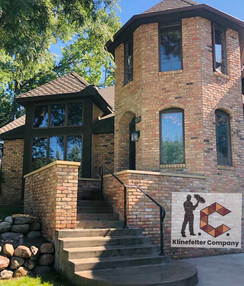 Brick house with tower and front steps
